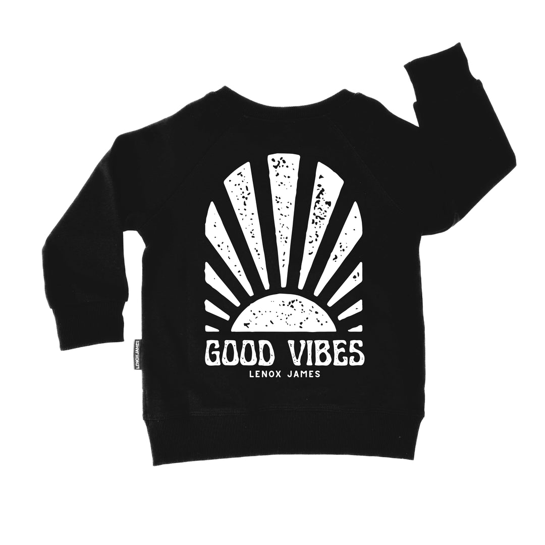 Black sweatshirt with 'Good Vibes' design and brand name on a white background