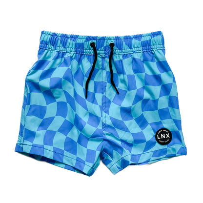 A pair of blue swim trunk shorts with a geometric wavy check pattern, featuring a functional drawstring waist.