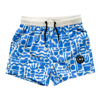 A pair of blue swim trunks with a geometric pattern, featuring a functional drawstring waist and a soft mesh spandex liner.