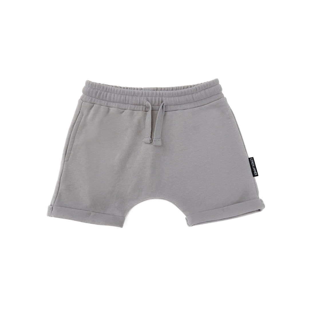 Gray shorts with a brand label on a white background