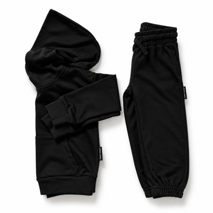 LENOX JAMES kids hoodie in black styled alongside matching joggers as a coordinated two-piece outfit.