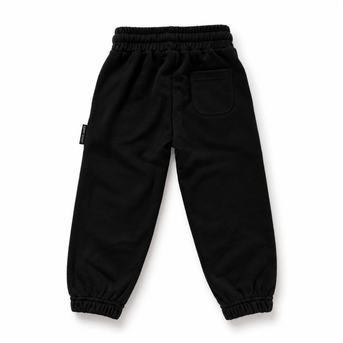 Back view of LENOX JAMES kids joggers in black, showing the rear patch pocket, elastic waistband and gathered cuffs.