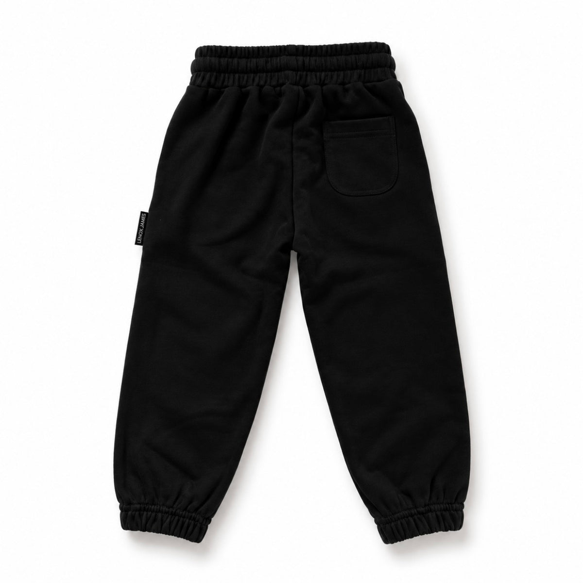 Back view of LENOX JAMES kids joggers in black, showing the rear patch pocket, elastic waistband and gathered cuffs.