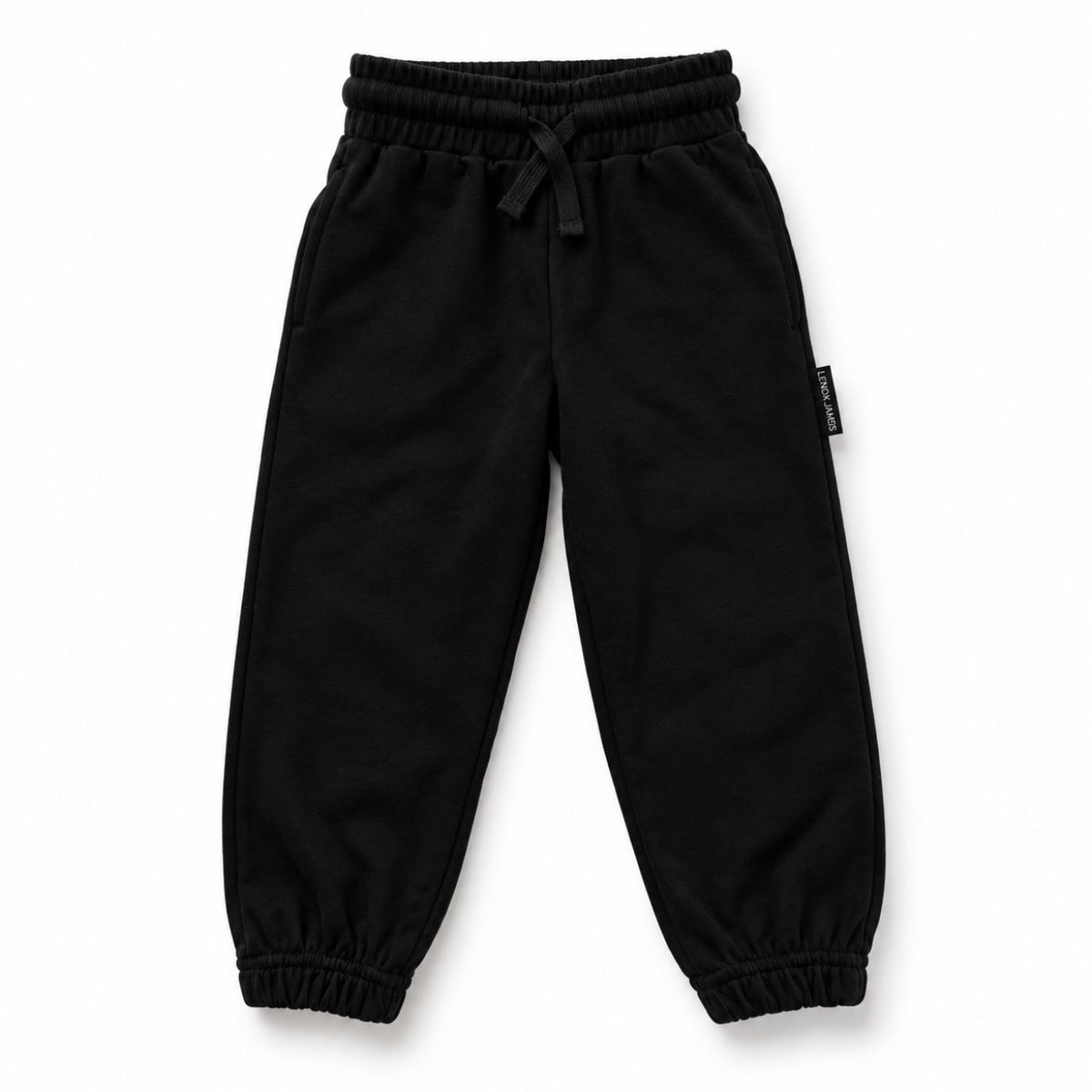 Front view of LENOX JAMES kids joggers in black, with an elastic drawstring waist, side pockets and cuffed ankles.