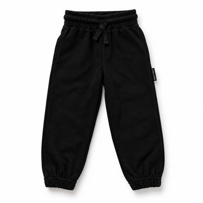 Front view of LENOX JAMES kids joggers in black, with an elastic drawstring waist, side pockets and cuffed ankles.