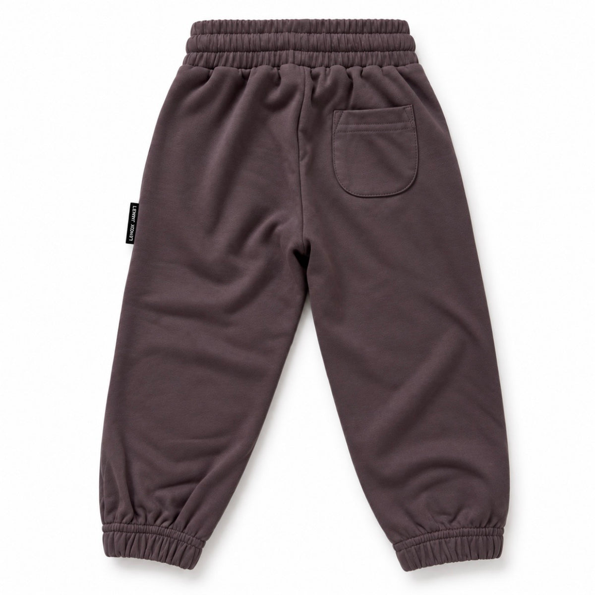 Back view of LENOX JAMES kids joggers in smoky purple-gray, showing the rear patch pocket, elastic waistband and gathered cuffs.