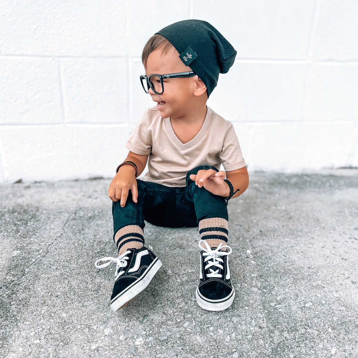 Child wearing a LENOX JAMES coffee brown V-neck tee with casual bottoms