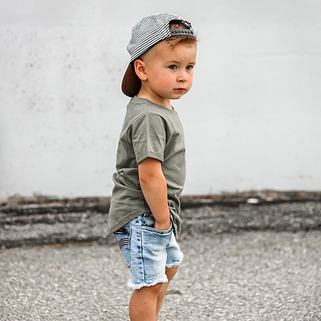 Child wearing a LENOX JAMES olive green cotton basic tee styled with denim